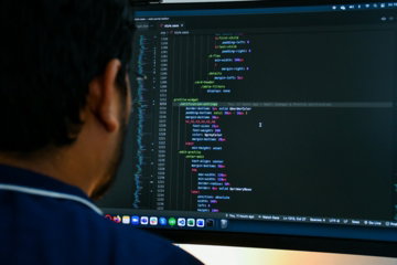 a man looking at a computer screen